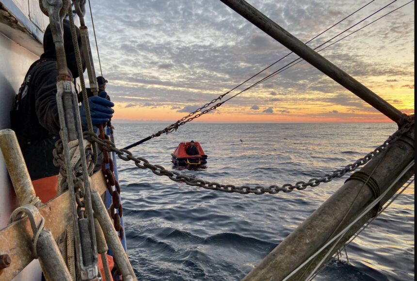 <p>(U.S. Coast Guard Pacific Northwest) A &ldquo;good Samaritan&rdquo; vessel on Thursday, Oct. 26 approaches a life raft holding one of the two crew members from the missing fishing vessel Evening, found alive nearly two weeks after the boat was scheduled to return to Grays Harbor. The other crew member remains missing.</p>