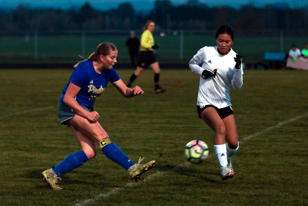 DYLAN WILHELM | THE CHRONICLE Raymond-South Bend’s Megan Kongbouakhay (1) defends against Adna’s Margarite Humphrey during the Ravens’ 2-1 loss in the first round of the 2B District 4 Tournament on Monday in Adna.