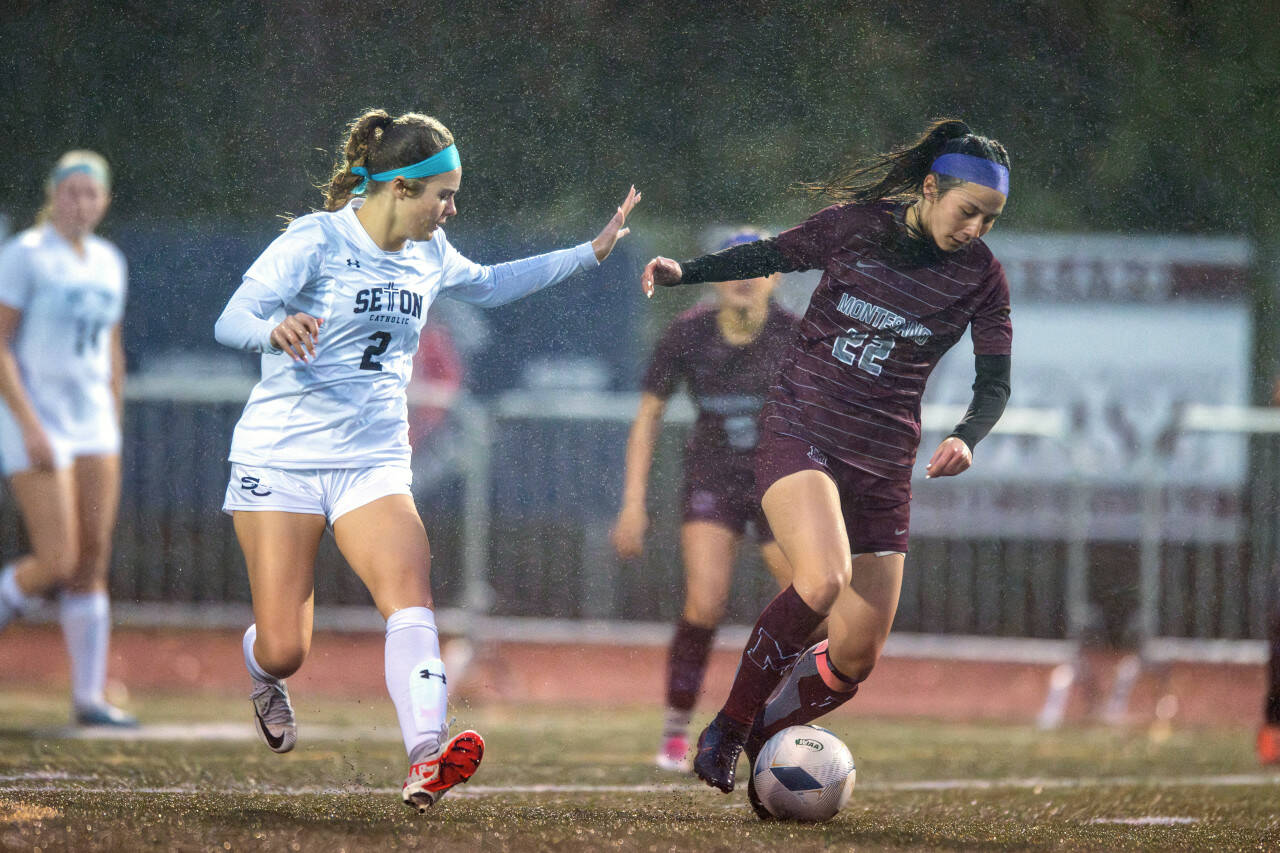 PHOTO BY FOREST WORGUM Montesano midfielder Bethanie Henderson (22) dribbles against Seton Catholic’s Alyssa Mancuso during the Bulldogs’ 3-2 victory in the 1A District 4 semifinals on Thursday in Montesano.