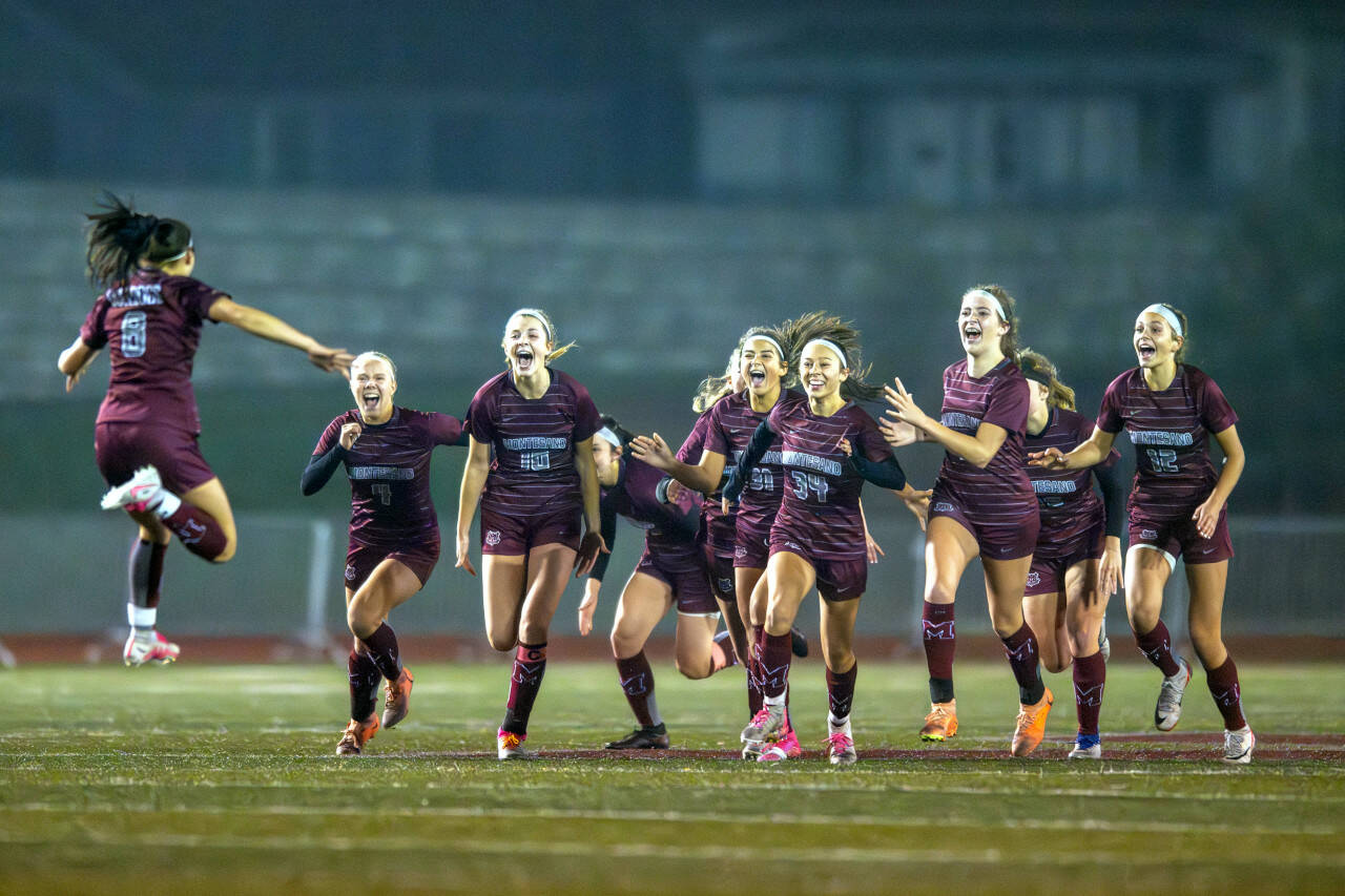 PHOTO BY FOREST WORGUM The Montesano Bulldogs celebrate with Adda Potts (8) after Potts clinched a 2-1 victory with a conversion in a penalty-kick shootout against Bellevue Christian in a 1A State Tournament first-round game on Wednesday in Montesano.