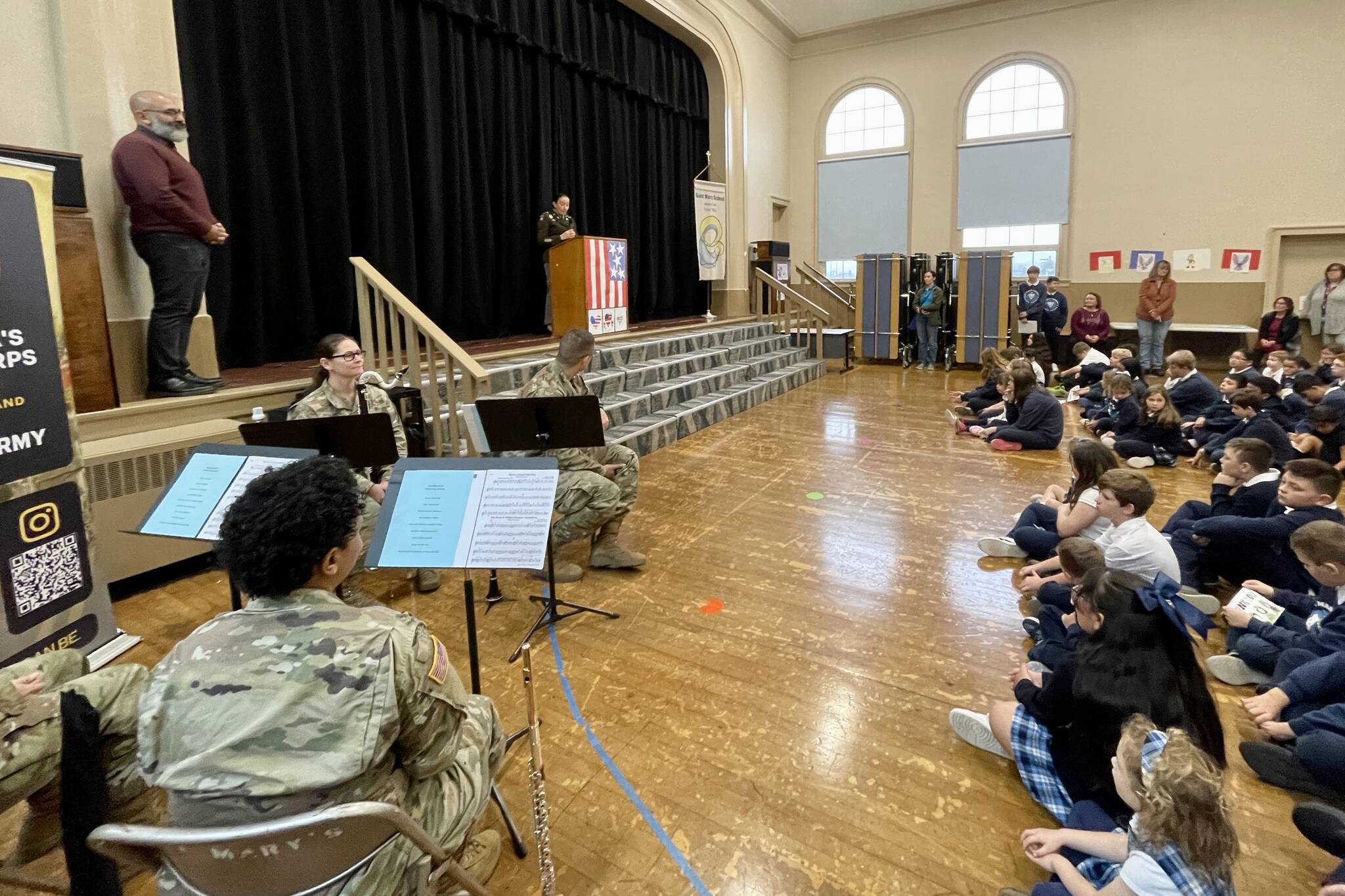 Students at St. Mary’s School gather for a Veterans Day assembly on Nov. 9. (Michael S. Lockett / The Daily World)