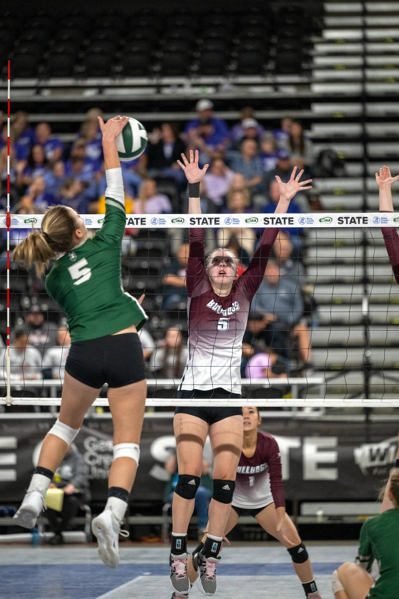 PHOTO BY FOREST WORGUM Montesano’s Karissa Otterstetter attempts to block a kill attempt by Chelan’s Lydia Petersen, left, during the 1A WIAA State Volleyball Tournament on Friday at the Yakima Valley SunDome.