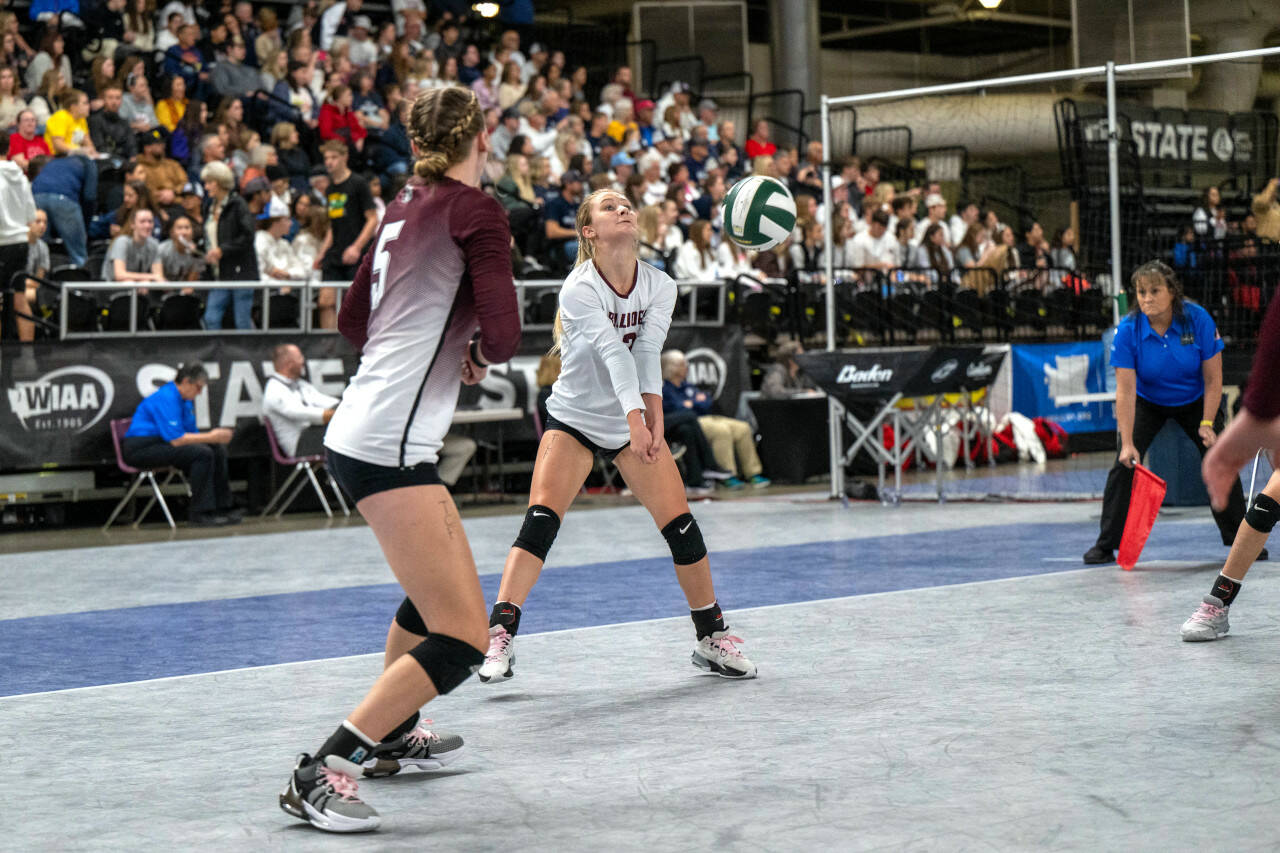 PHOTO BY FOREST WORGUM Montesano’s Bentley Warne, right, receives a serve during the 1A WIAA State Volleyball Tournament on Friday at the Yakima Valley SunDome.