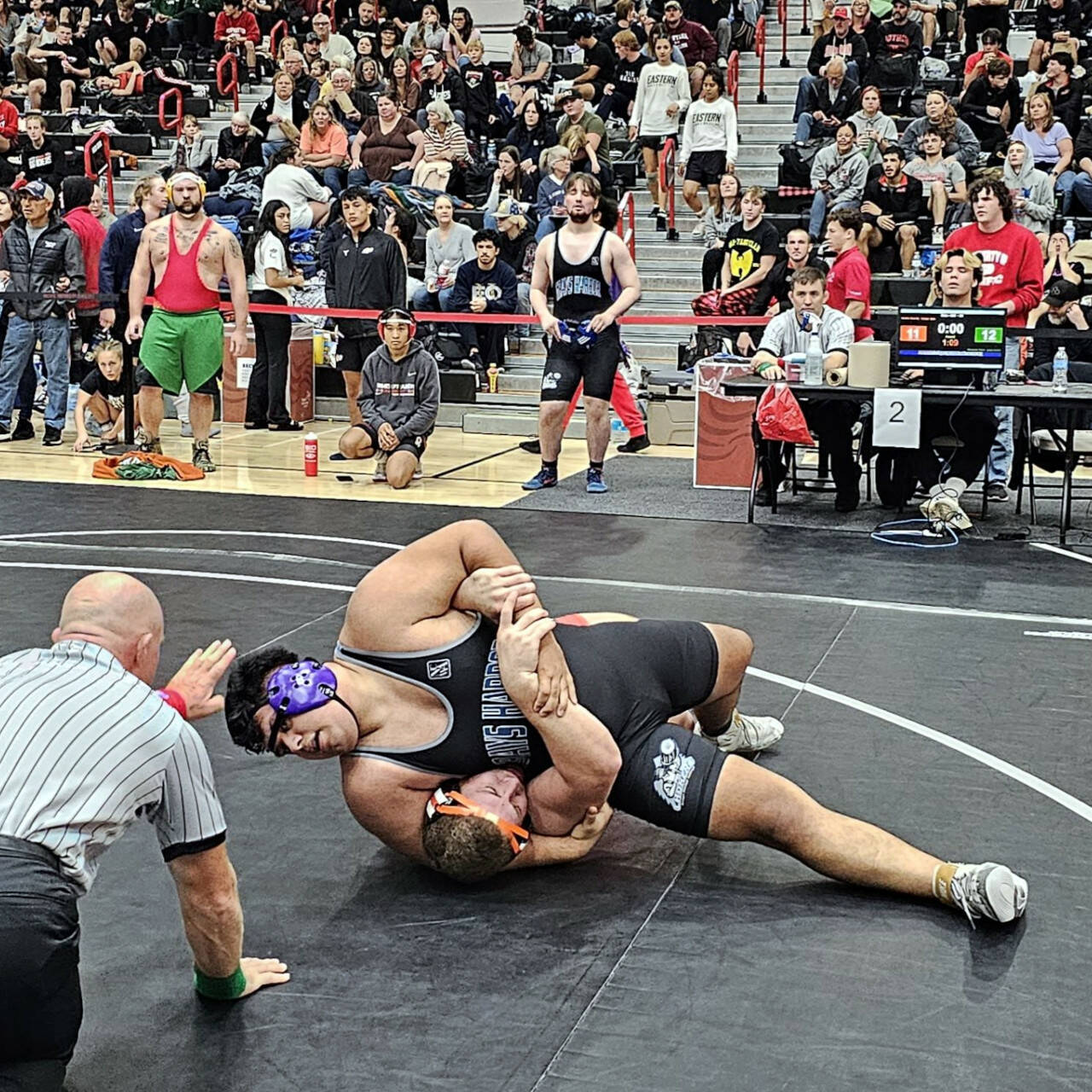 SUBMITTED PHOTO Grays Harbor College wrestler Alexander Perez, top, competes at the Mike Clock Open on Sunday in Forest Grove, Oregon.
