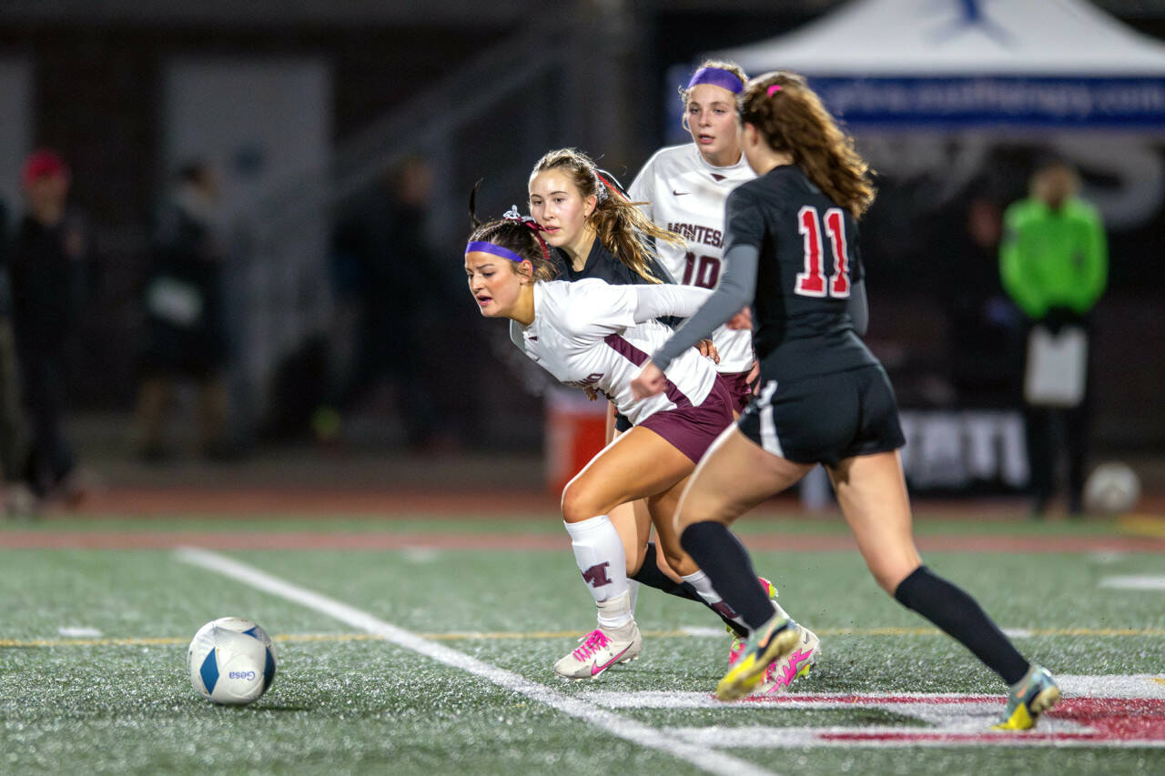 PHOTO BY FOREST WORGUM Montesano forward Adda Potts, middle, attempts to break through the Seattle Academy defense during the Bulldogs’ 1-0 loss in the 1A State semifinals on Friday at Mount Tahoma Stadium in Tacoma.