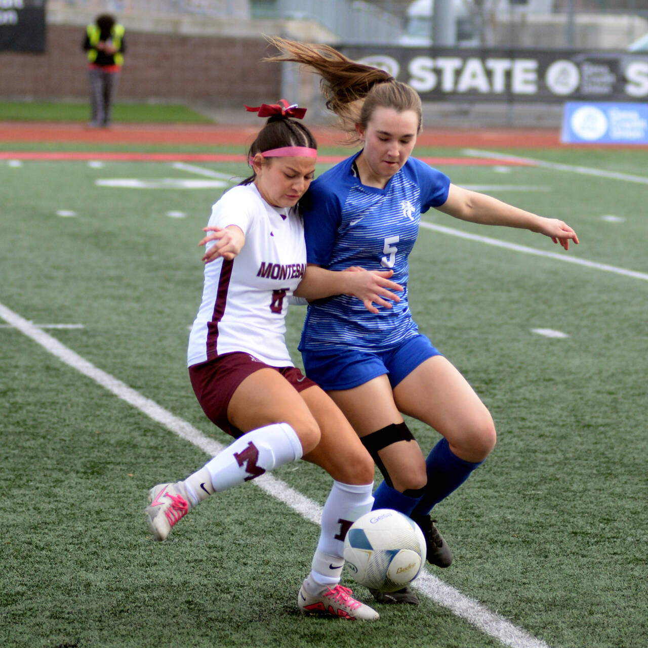 RYAN SPARKS | THE DAILY WORLD Montesano junior forward Adda Potts (8) shadows La Center senior midfielder Shaela Bradley during the Bulldogs’ 3-1 win over La Center in the 1A State third/fourth-place game on Saturday in Tacoma.