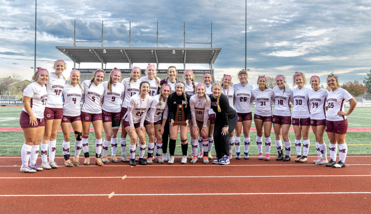 PHOTO BY SHAWN DONNELLY The Montesano Bulldogs pose for a photo with the 1A State third-place trophy after defeating La Center 3-1 in the 1A State Tournament on Saturday at Mount Tahoma High School in Tacoma.