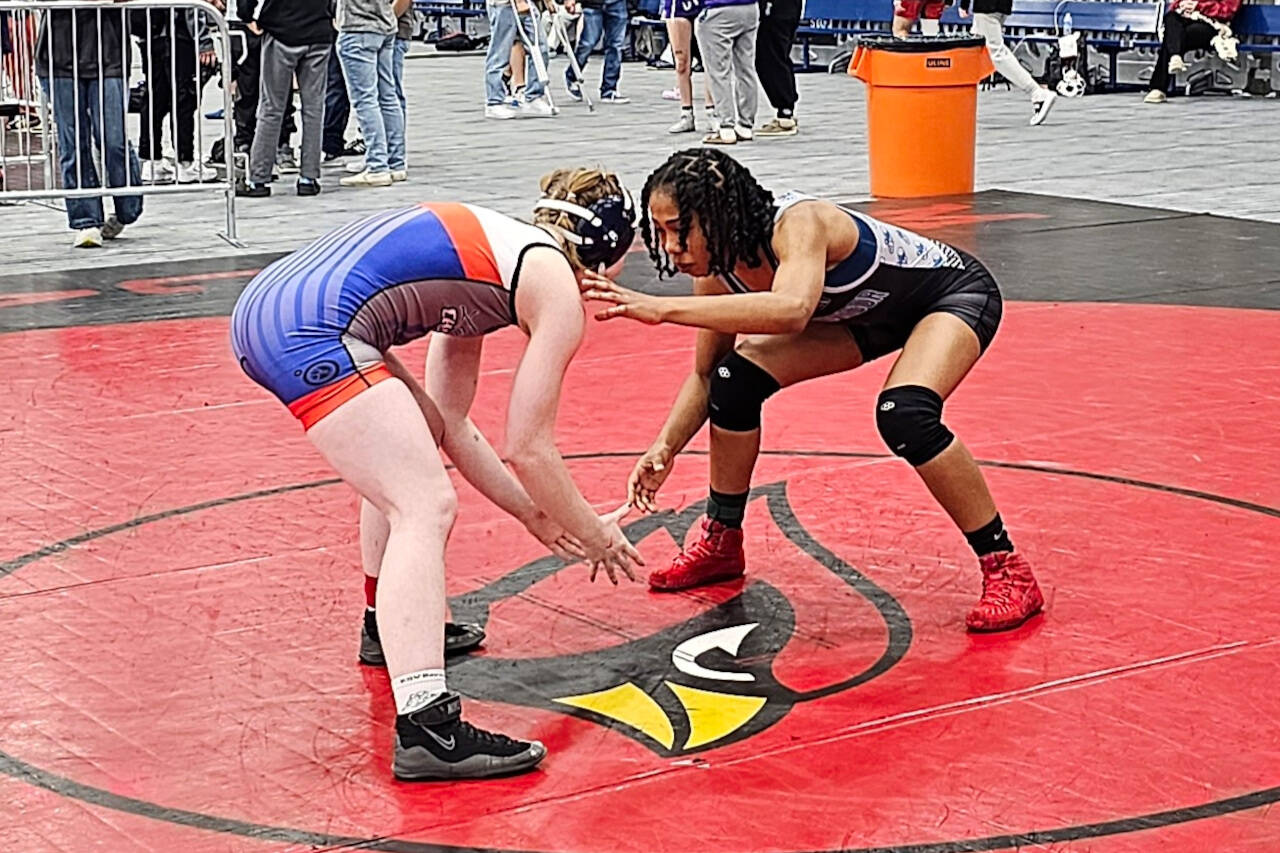 SUBMITTED PHOTO Grays Harbor College’s Maysa Brown, right, grapples with former Lady Chokers standout Tatum Pine (unattached) in the 130-pound final of the Spokane Open on Sunday.