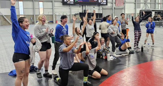 SUBMITTED PHOTO Grays Harbor College wrestlers cheer on a teammate during the Spokane Open on Sunday in Spokane.