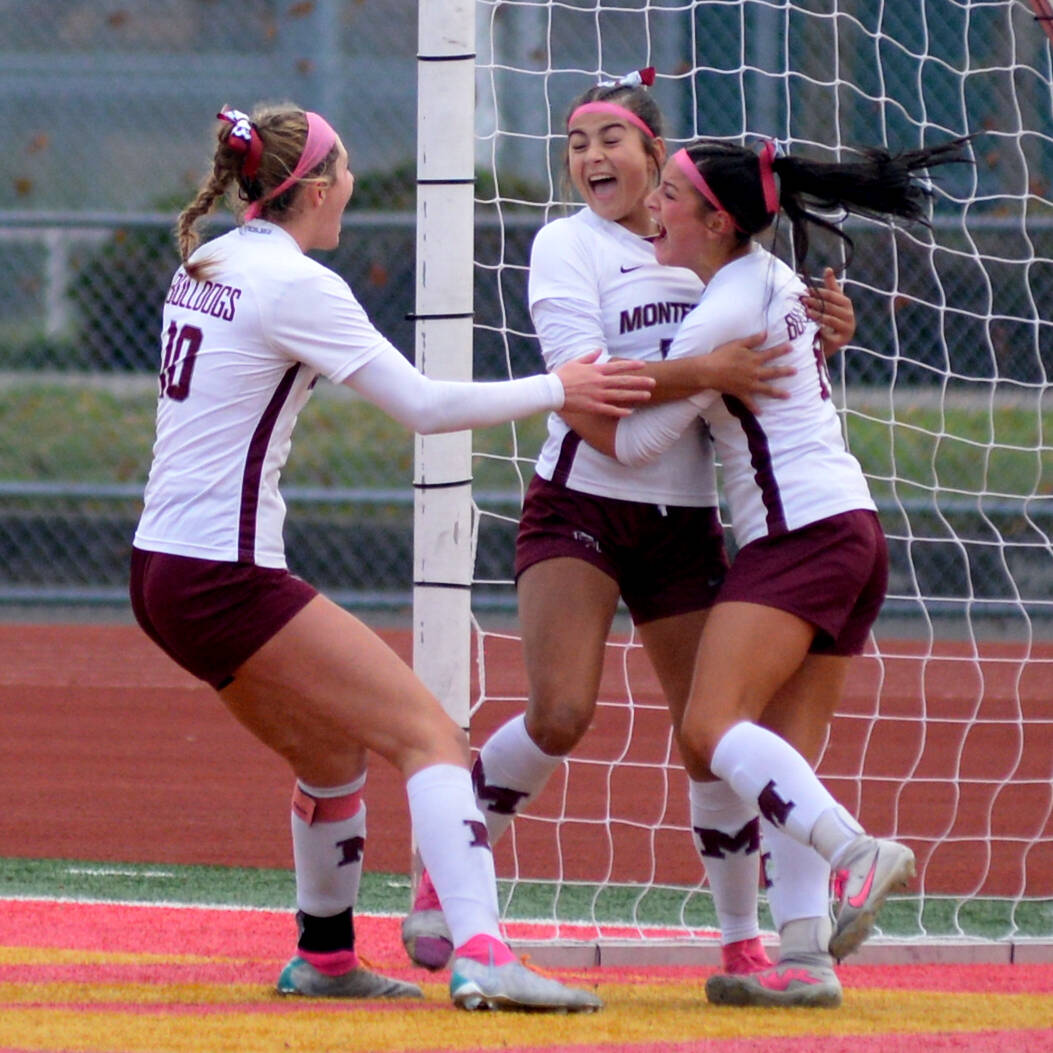 RYAN SPARKS | THE DAILY WORLD Montesano’s Adda Potts, right, and Mikayla Stanfield, left, celebrate with Jaelyn Butterfield after she scored a goal in the first half of a 3-1 win over La Center in the 1A State third-place game on Saturday in Tacoma.