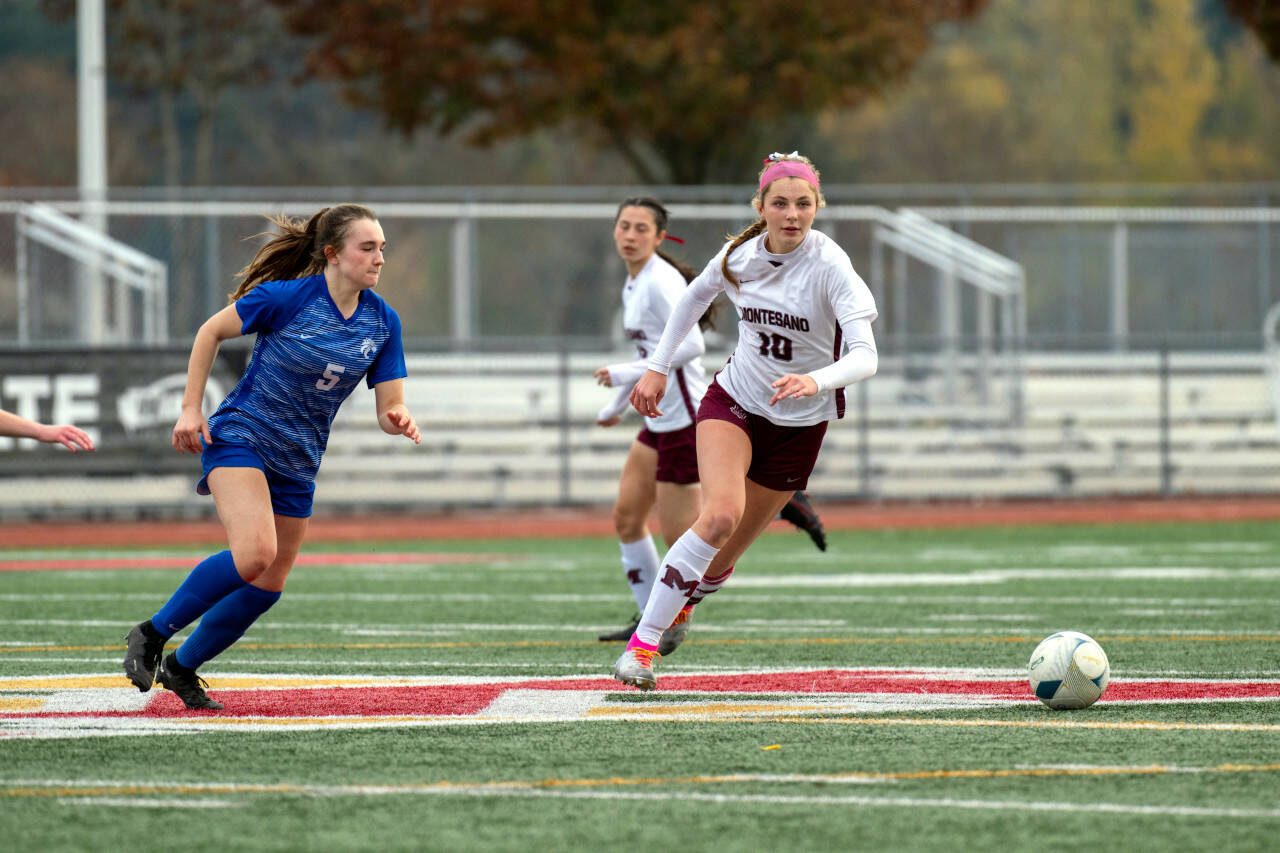PHOTO BY FOREST WORGUM Montesano senior forward/midfielder Mikayla Stanfield (10) chases the ball down against La Center senior Shaela Bradley during the Bulldogs’ 3-1 win in the 1A State third-place game on Saturday at Mount Tahoma Stadium in Tacoma.