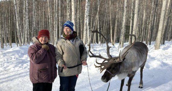 Provided photo
Dawn Keogh, center, stands with her friend Connie, left, and a reindeer at a Running Reindeer Ranch in Fairbanks, Alaska, in between her two “cancer journeys.” Keogh fought colon cancer during 2018 and 2019. Then in 2023, she was diagnosed with peritoneal cancer. On Sunday, Hoquiam Brewing Company and Mark Bowman will host a fundraiser for Keogh.