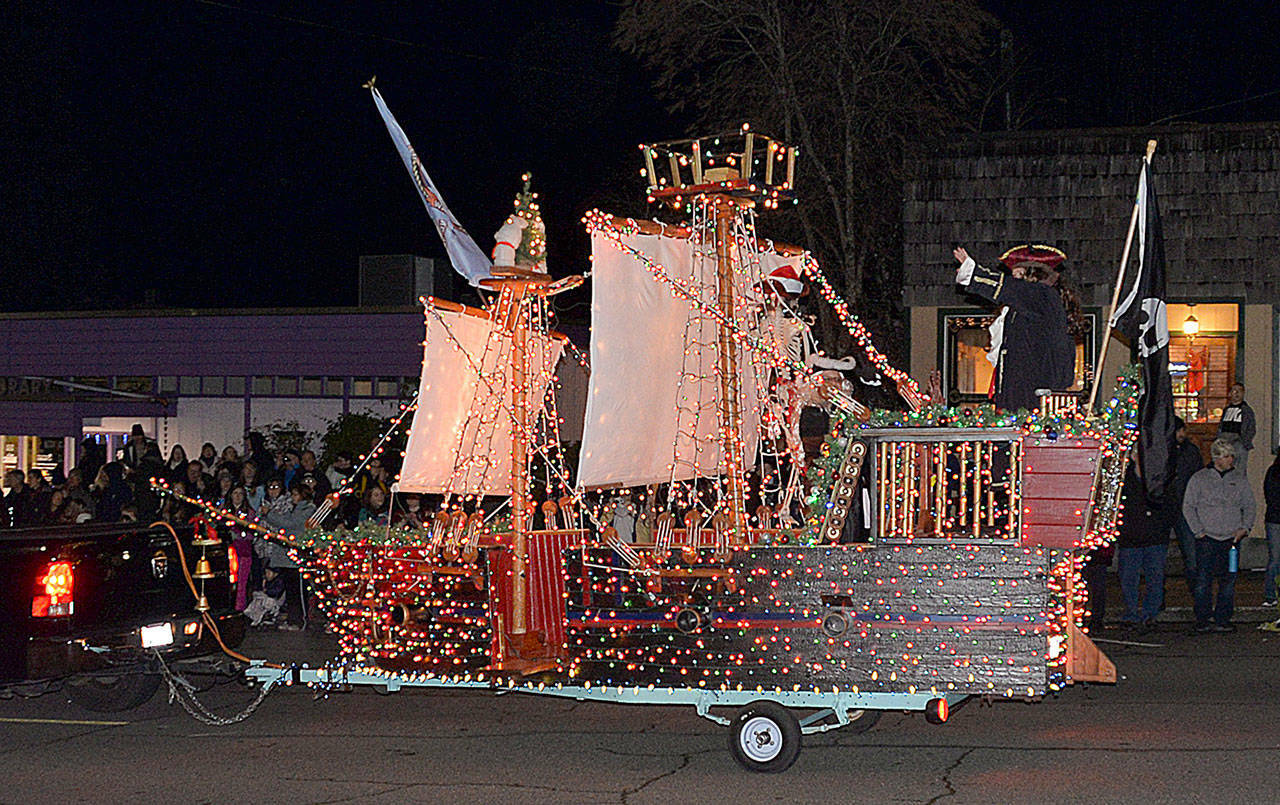 Dan Hammock / The Daily World file photo
The Montesano Festival of Lights grand parade rolls through town at a past event.