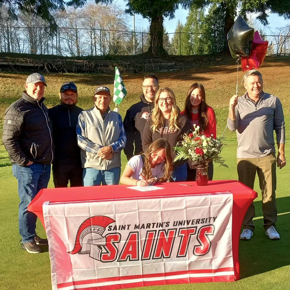 SUBMITTED PHOTO Montesano senior golfer Hailey Blancas, seated, signs a Letter of Intent to compete for Saint Martin’s University on Sunday, Nov. 26, at Highland Golf Course in Cosmopolis. Pictured standing are (from left): Montesano High School coaches Doug Galloway and Loyal Linton, PGA pro Joe Golia, father Arnel Blancas, mother Kim Blancas, sister Makena Blancas and PGA pro Ronnie Espedal.