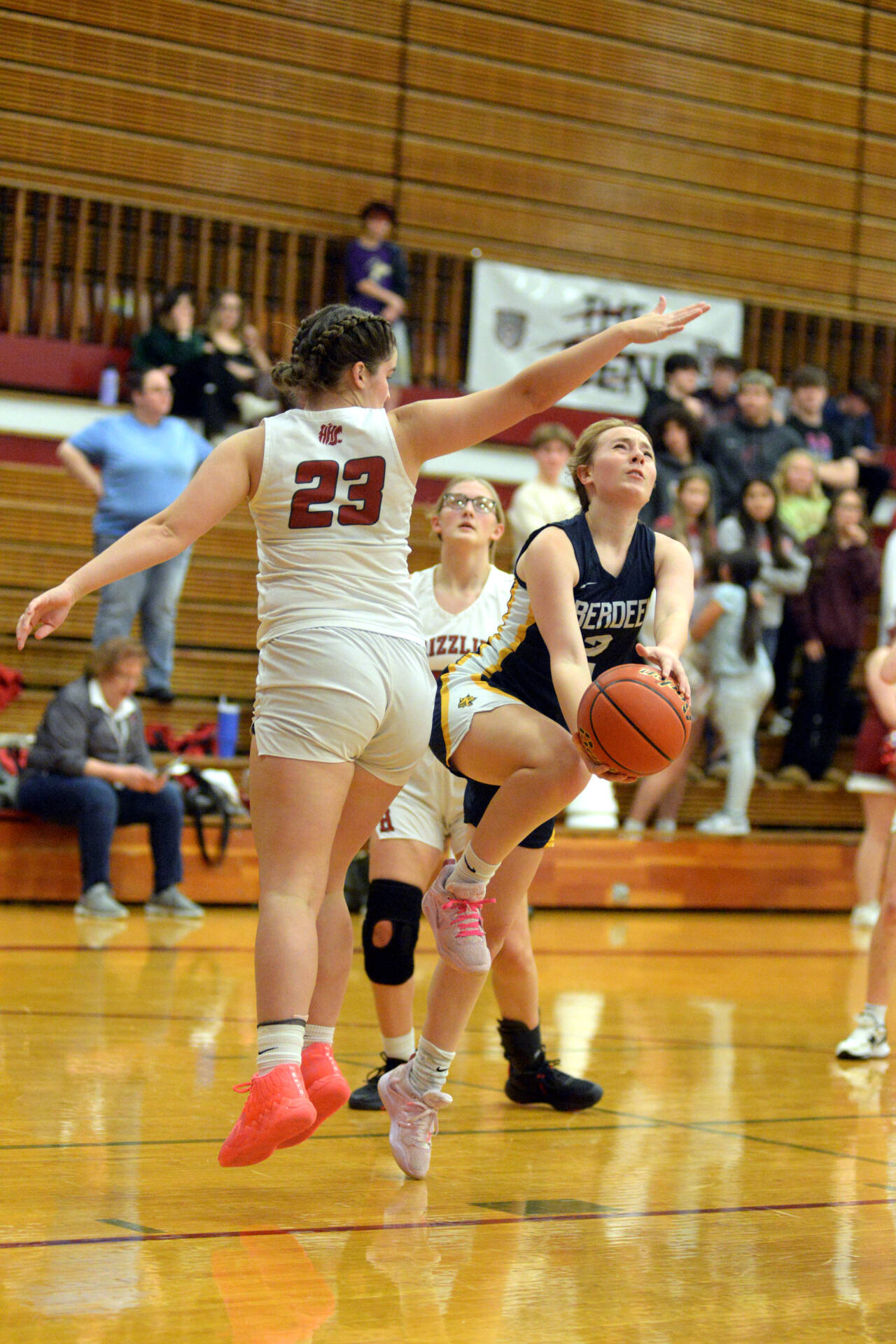 RYAN SPARKS | THE DAILY WORLD Aberdeen senior guard Annie Troeh (2) performs a Euro-step layup against Hoquiam’s Avery Howard in the first quarter of the Bobcats’ 53-32 victory on Friday in Hoquiam.