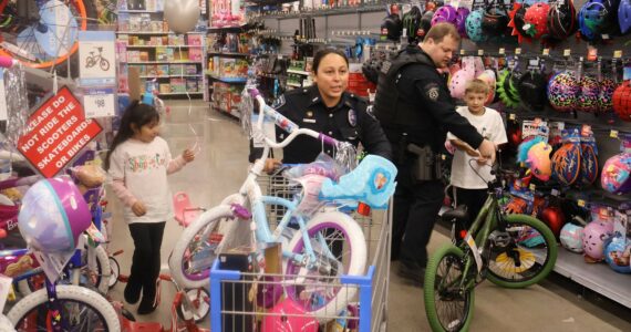 Michael S. Lockett / The Daily World
Law enforcement personnel and children buddied up for the annual Shop with a Cop event on Saturday.