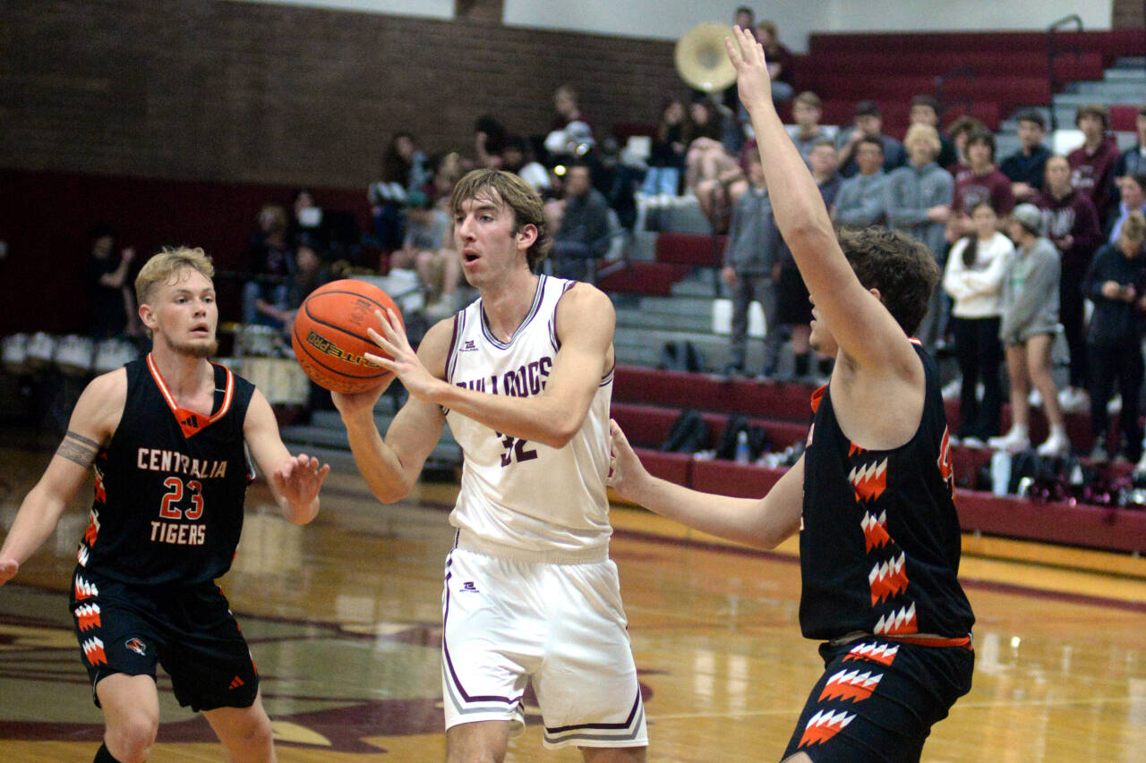 RYAN SPARKS | THE DAILY WORLD Montesano center Soren Cobb (32) passes the ball during a 69-43 win over Centralia on Tuesday at Montesano High School.