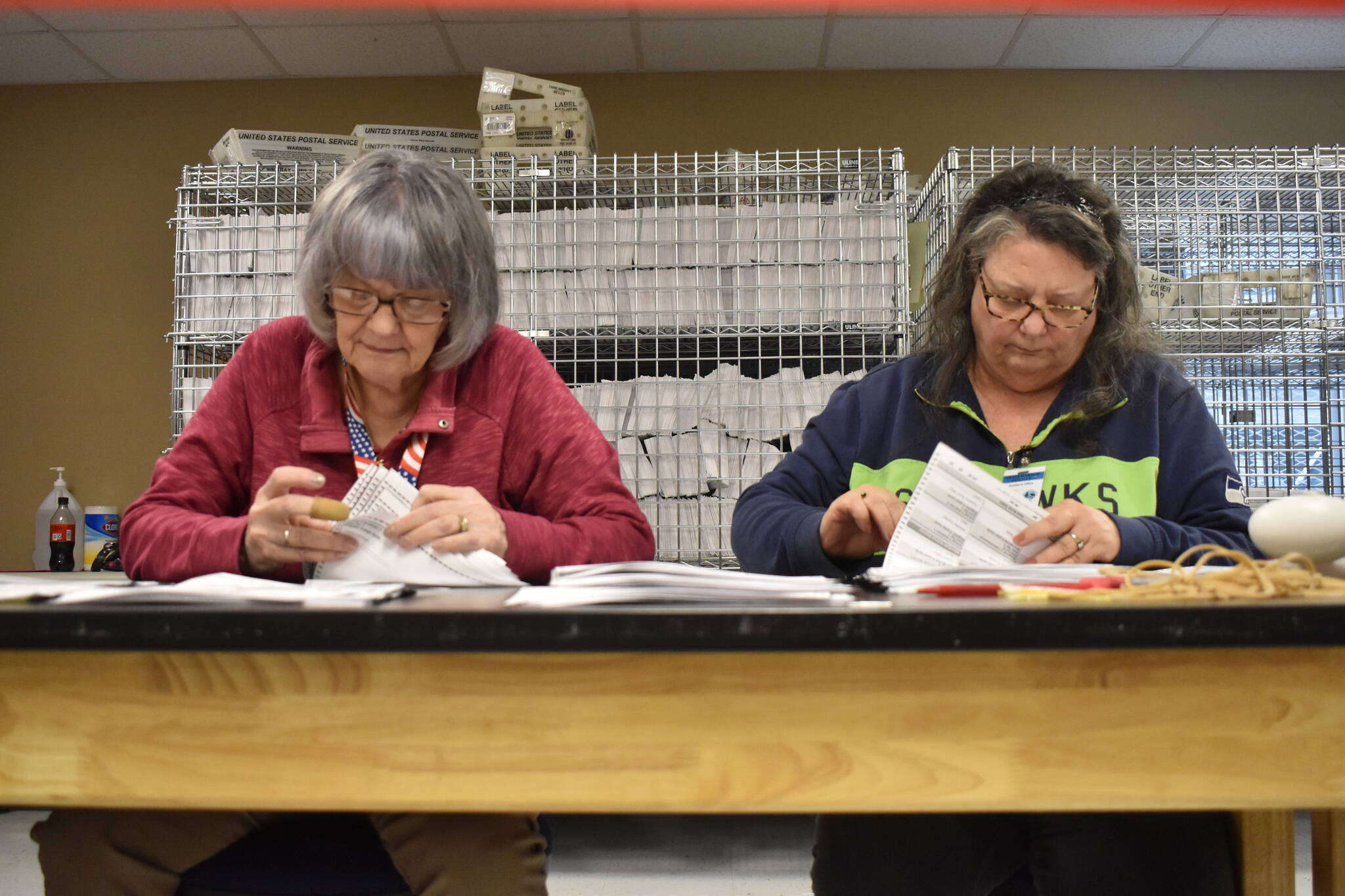 Grays Harbor County elections employees Sue Wilson and Debby Hammer recount ballots by hand at the county elections office in Montesano on Thursday, Dec. 7. (Clayton Franke / The Daily World)