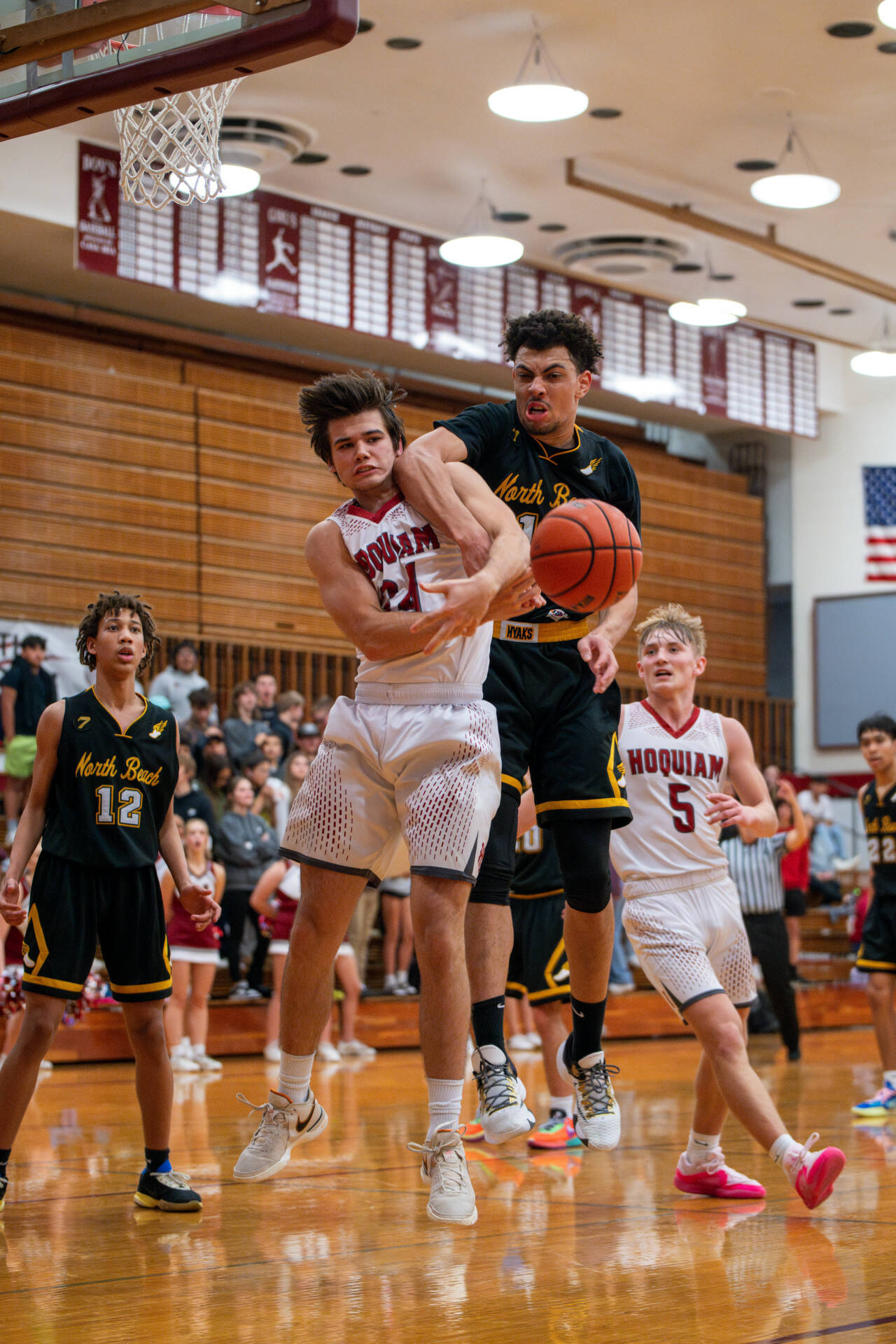 PHOTO BY FOREST WORGUM Hoquiam guard Lincoln Niemi, left, collides with North Beach’s Tyrell Hovland during the Grizzlies’ 71-31 victory on Thursday at Hoquiam Square Garden.