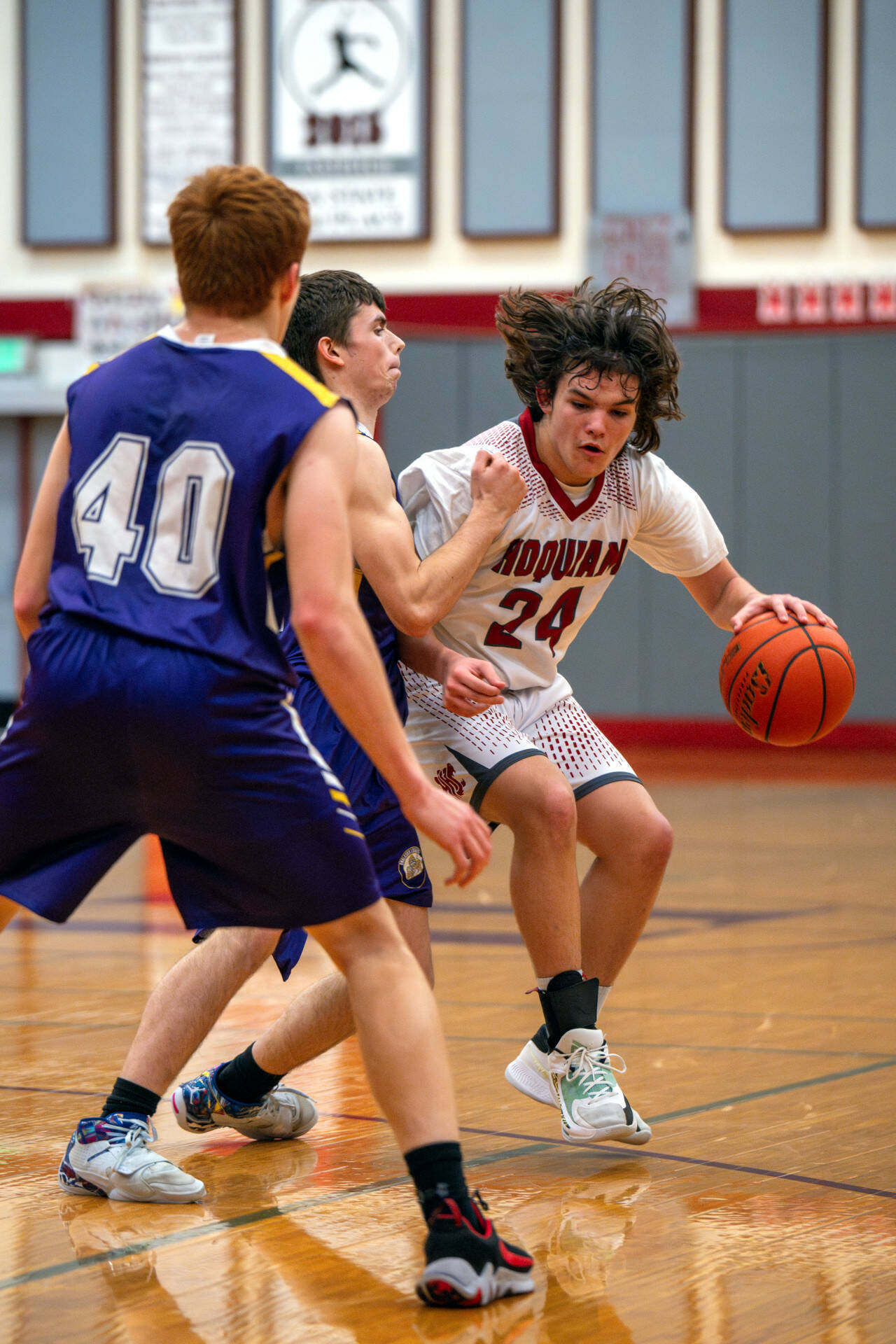 PHOTO BY FOREST WORGUM Hoquiam guard Lincoln Niemi (24) dribbles against Onalaska in an 86-44 win on Thursday in Hoquiam.