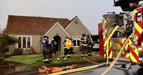 Firefighters fight a house fire in Aberdeen on Thursday morning. (Michael S. Lockett / The Daily World)