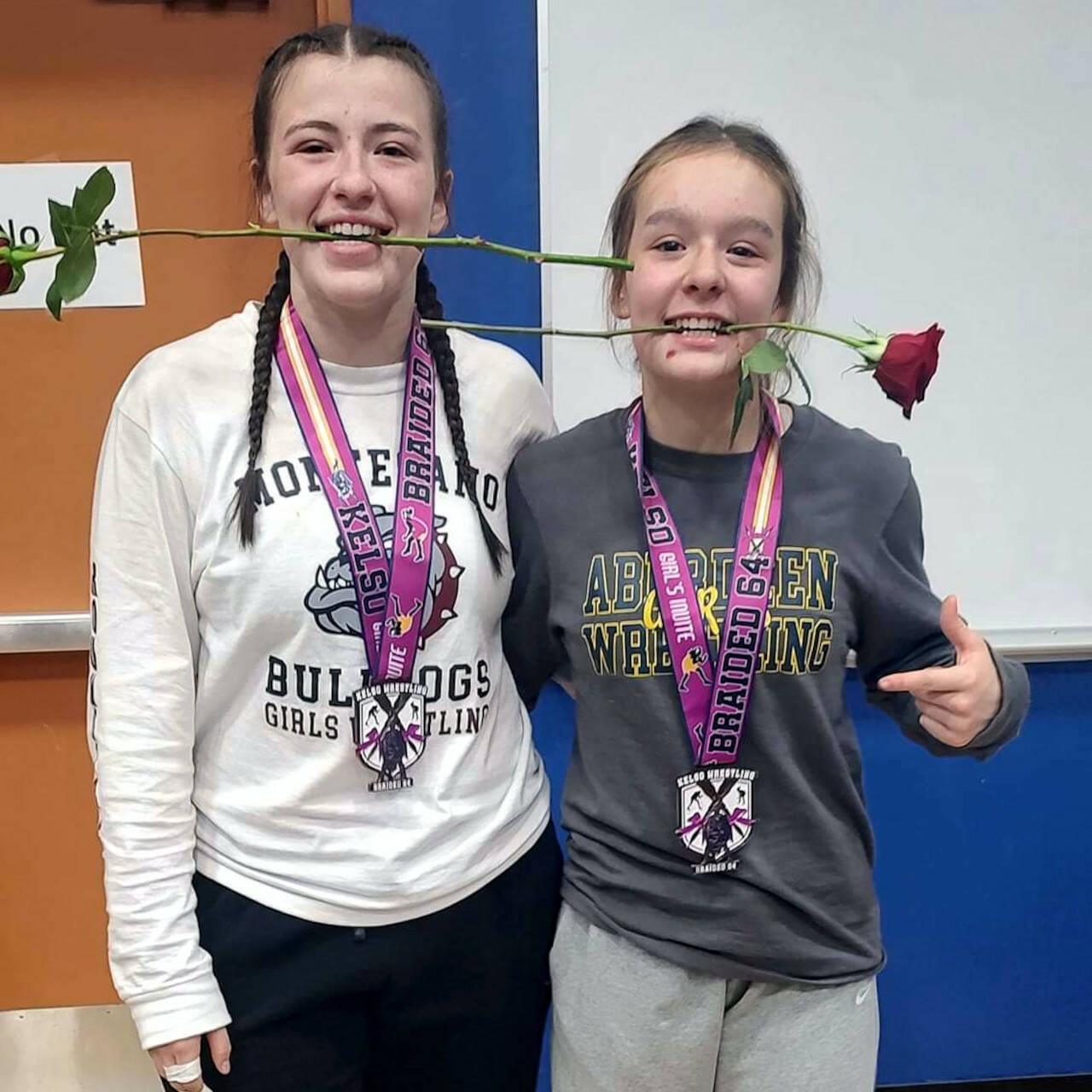 PHOTO BY TAMARA YAKOVICH Montesano’s Kya Roundtree, left, and Aberdeen’s Felicia Bell pose for a photo after placing on the podium of their respective weight classes on Saturday at the Braided 64 meet in Kelso.
