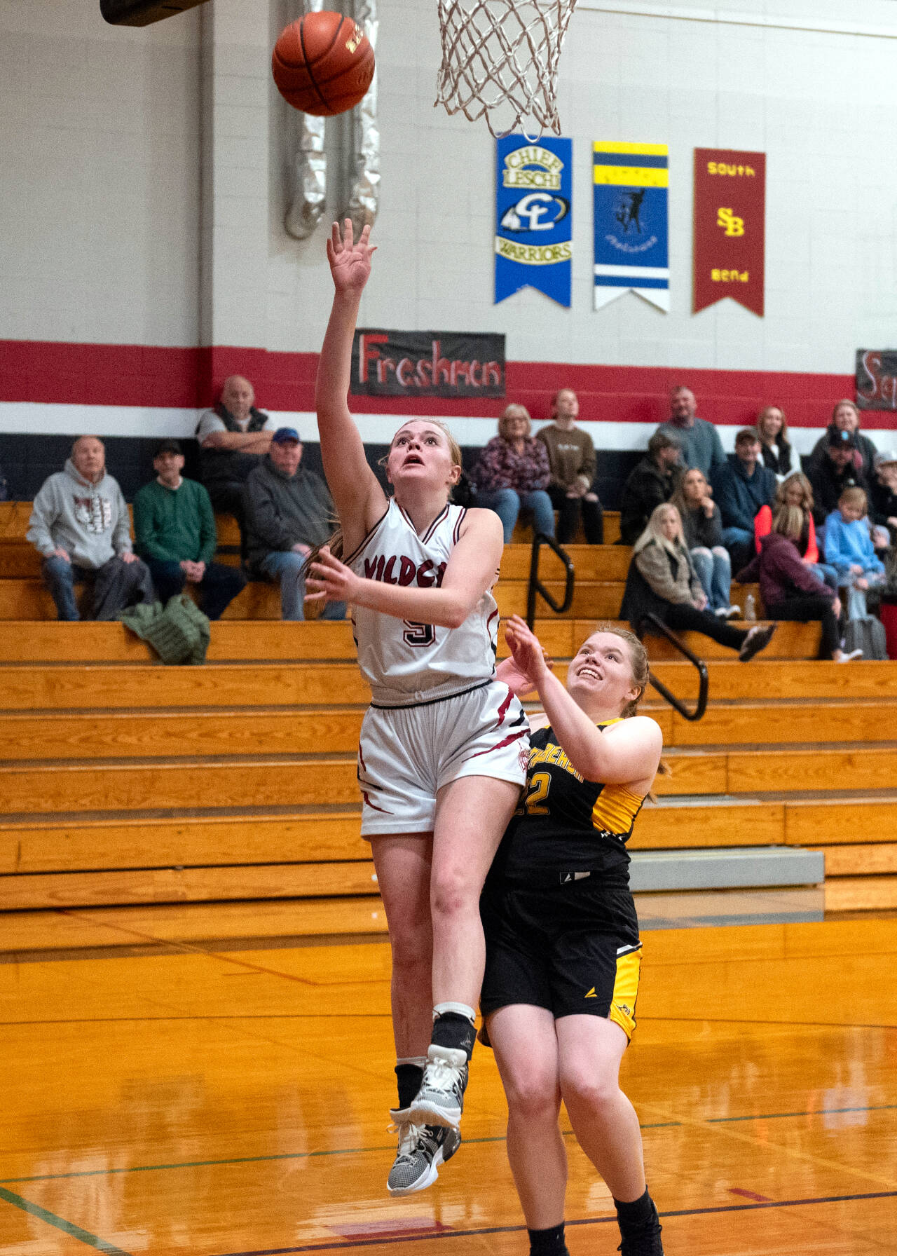 PHOTO BY VAN ADAM DAVIS Ocosta sophomore Anna Davis (5) scores two of her game-high 26 points against North Beach’s Madison Crooks during the Wildcats’ 62-30 on Wednesday in Westport.