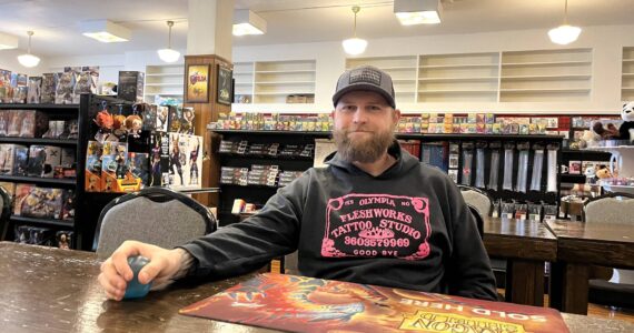 Matthew N. Wells / The Daily World
Thomas Hedlund, one of the owners of Game Freaks Aberdeen, sits at one of the gamer tables inside his shop at 121 W. Wishkah St. The shop will move up the street to 108 E. Wishkah St. The move will allow much more space for gaming, a dedicated Dungeons & Dragons room, and other improvements gamers will notice.