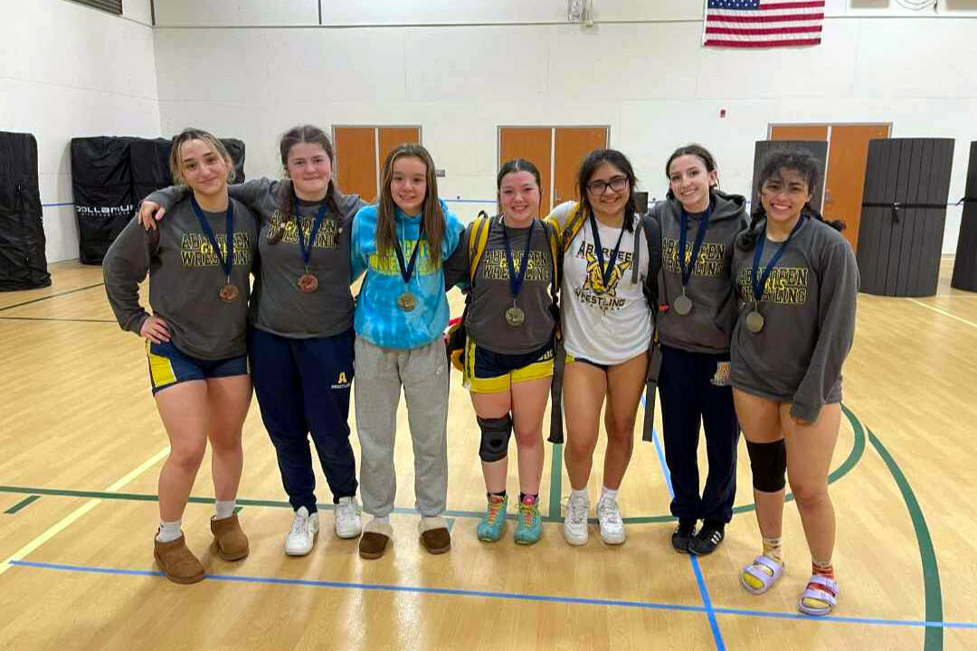 SUBMITTED PHOTO Aberdeen’s wrestlers (from left) Mycah Good, Abigail Warmoth, Felicia Bell, Kadence Braaten, Selena Martinez, Micah Turpin and Peityn Munoz each earned a podium spot at the River Ridge Rumble on Saturday in Lacey.