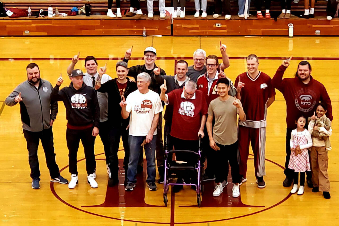 SUBMITTED PHOTO Hoquiam’s 2004 state-championship team was honored at halftime of the Grizzlies’ game against Aberdeen on Friday at Hoquiam High School.