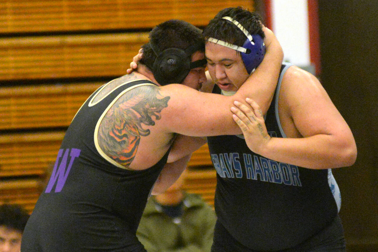 RYAN SPARKS | THE DAILY WORLD Grays Harbor College’s Rocco Clark, right, grapples with University of Washington’s Keegan Bach during the 2024 NCWA Men’s Western Duals on Sunday in Hoquiam.