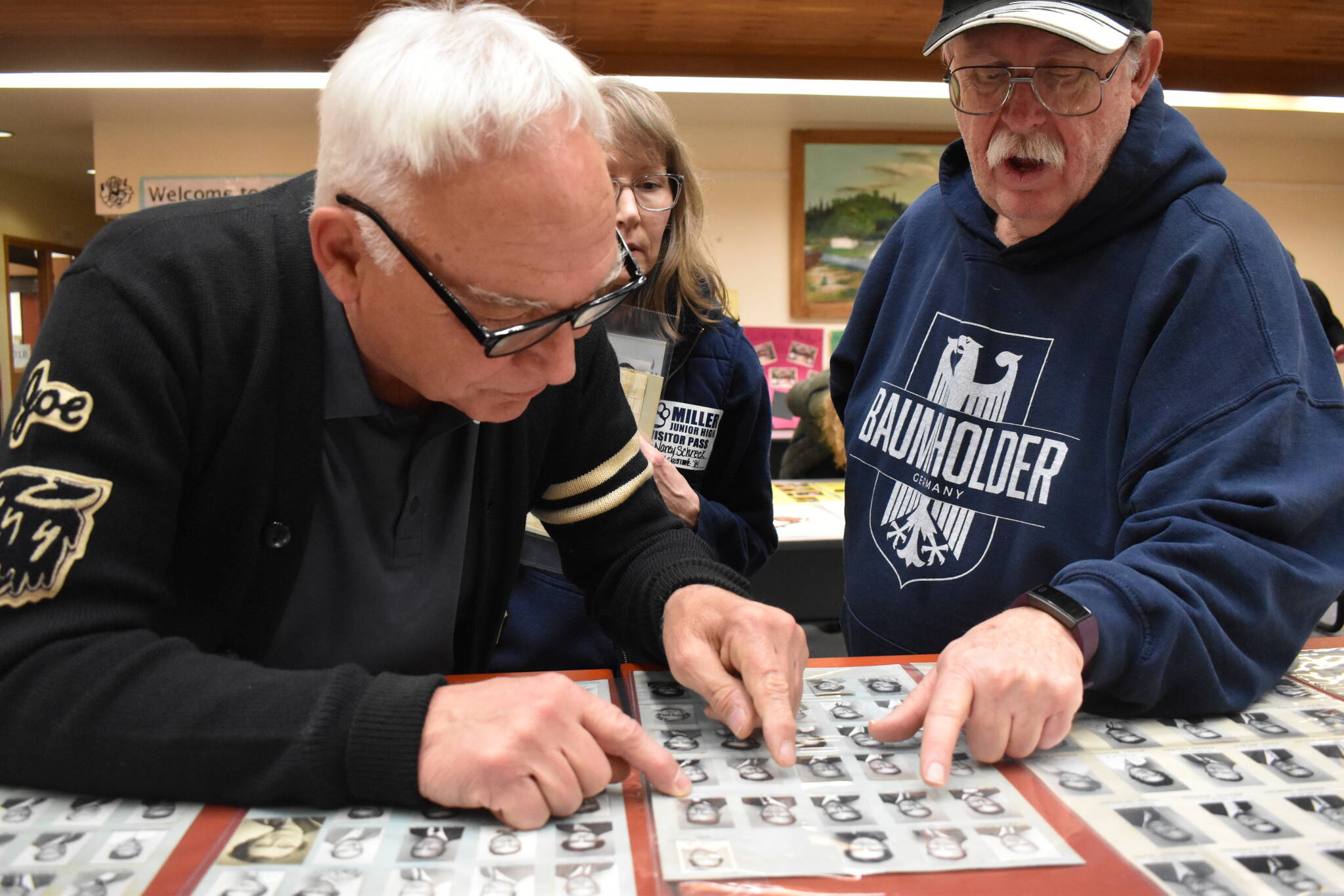 Clayton Franke / The Daily World
Former Miller Jr. High School students Joe Chicano, left and Mike Van Blaricom peruse old yearbook photos, identifying old teachers.