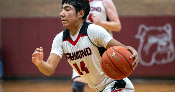 PHOTO BY FOREST WORGUM Raymond guard Chris Quintana led the Seagulls with 20 points in a 60-49 loss to Toledo in a 2B District 4 Tournament game on Saturday in Montesano.