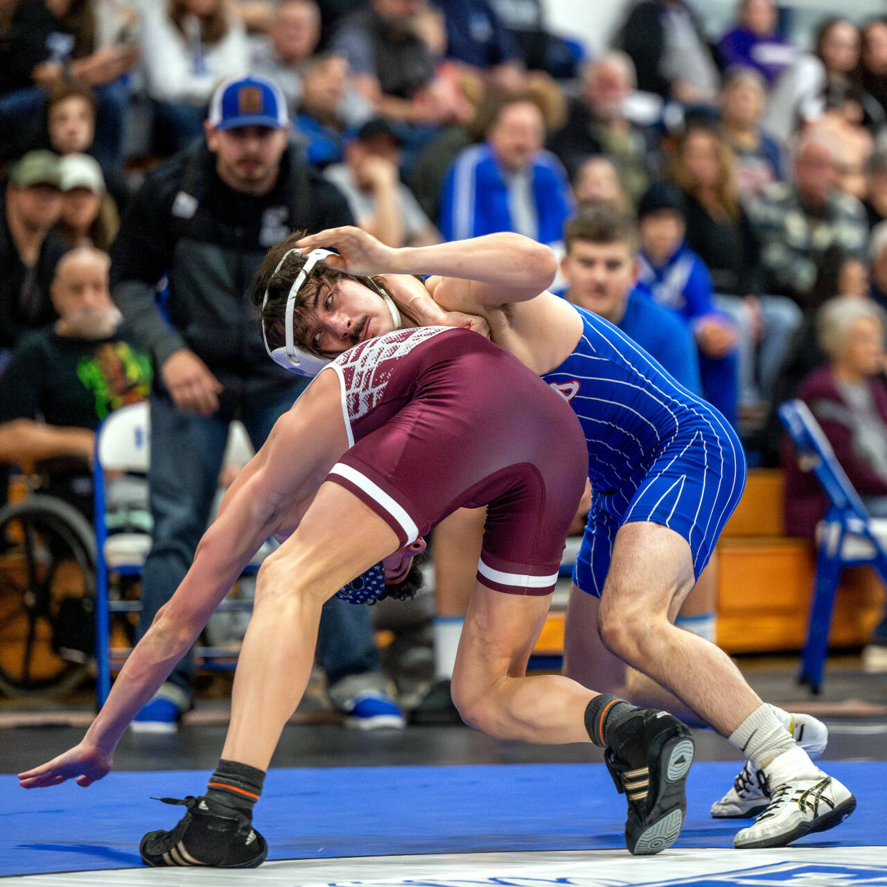 PHOTO BY FOREST WORGUM Elma senior Kale Reeves, right, wrestles with Montesano’s Pablo Moreno in a 126-pound match at the 1A Evergreen Sub-Regionals on Saturday at Elma High School.