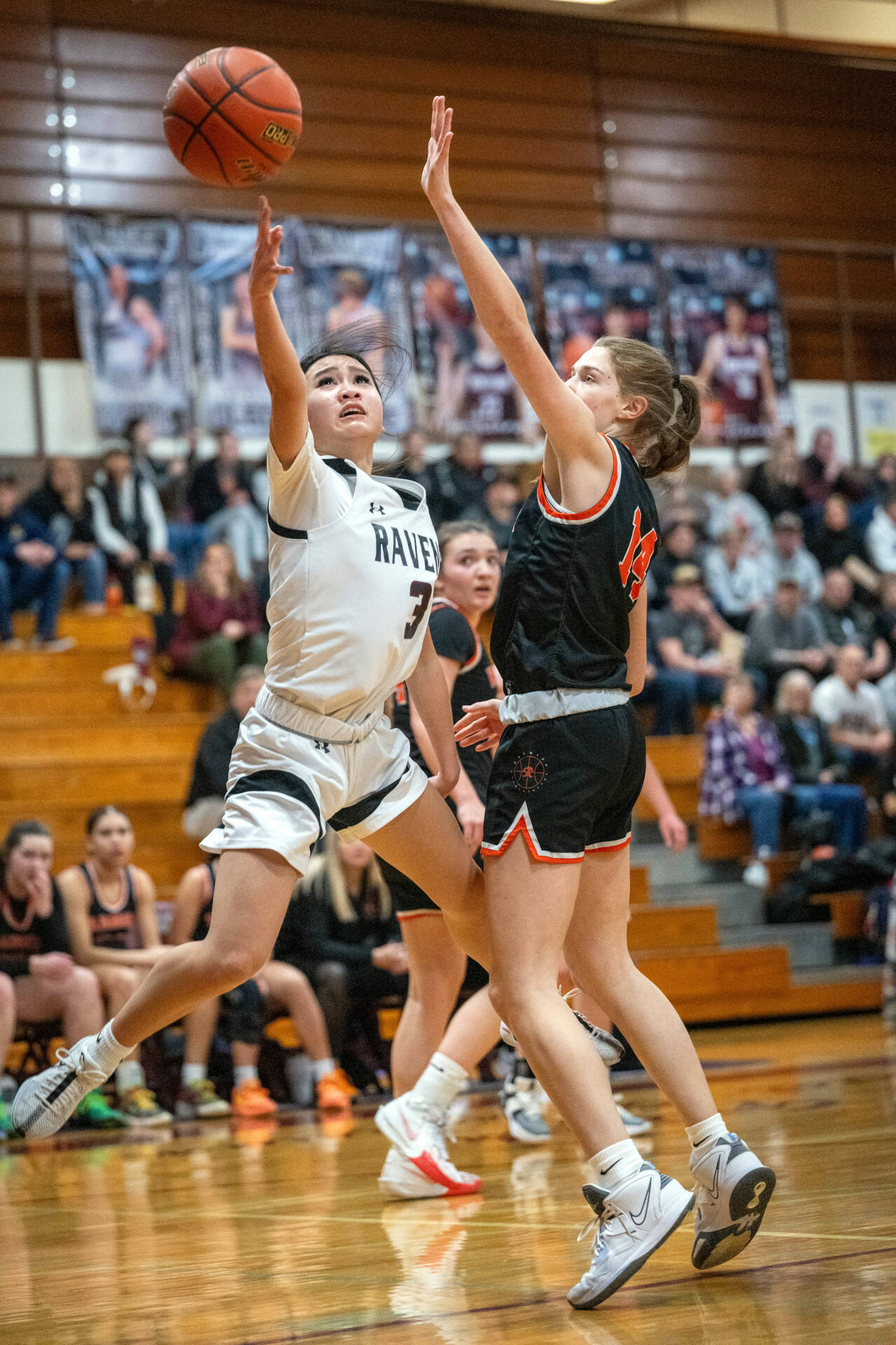 PHOTO BY FOREST WORGUM Raymond-South Bend guard Megan Kongbouakhay (3) puts up a shot against Rainier’s Anika Plowman during the Ravens’ 70-48 loss in the 2B District 4 Tournament on Tuesday in Montesano.