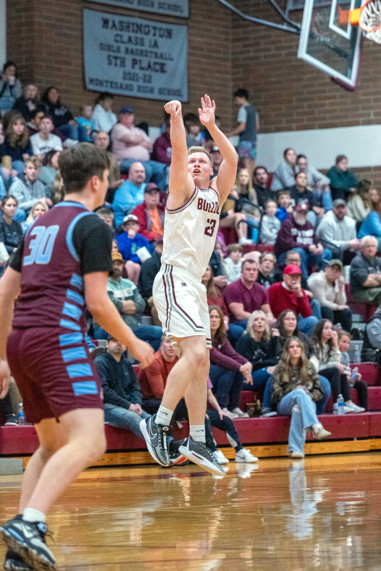 PHOTO BY FOREST WORGUM Montesano senior Tyce Peterson drains a 3-pointer during the Bulldogs’ 75-58 victory over Stevenson in a 1A District 4 Tournament game on Wednesday in Montesano.