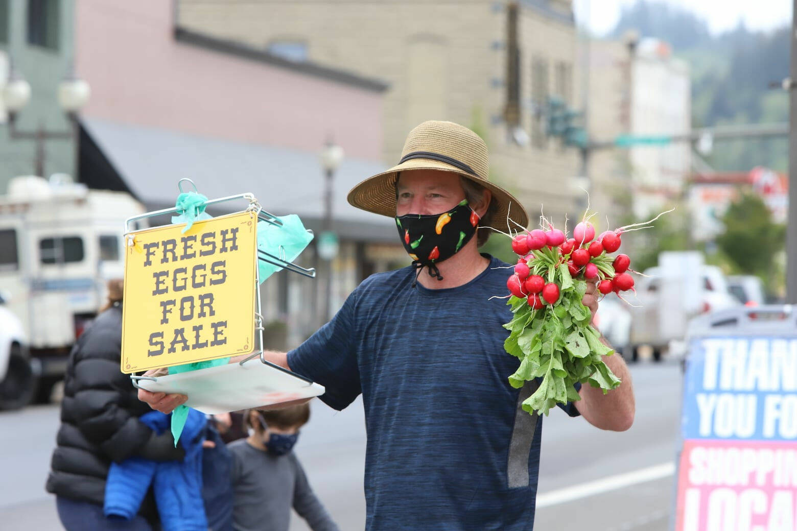 Rick Moyer / Moyer Multimedia
Rob Horton, who runs Bee Organics Farm and Apiary in Elma, sells radishes at a past Aberdeen Sunday Market. Horton won’t sell at the market in 2024, and instead will lease some farmland to another Aberdeen market producer.