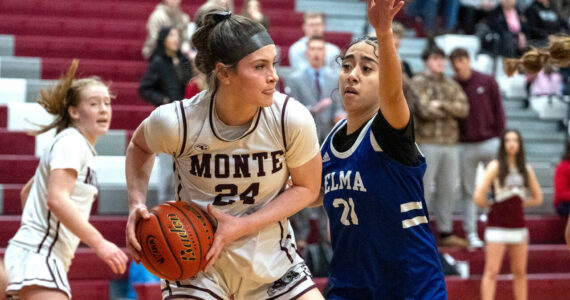 PHOTO BY FOREST WORGUM Montesano’s Jillie Dalan (24) is defended by Elma’s Malia Sibbett during the Bulldogs’ 37-22 win in a 1A District 4 semifinal game on Saturday in Montesano.