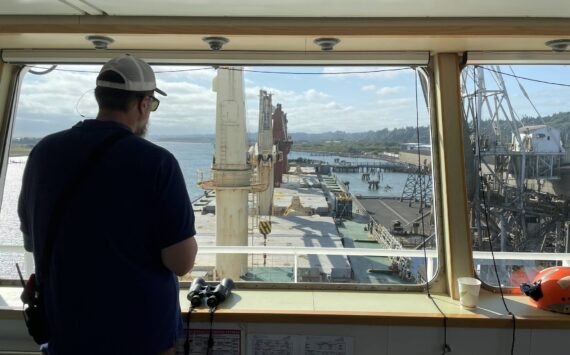 Michael S. Lockett / The Daily World File
Harbor pilot Capt. Ryan Leo of the Port of Grays Harbor eases the SLNC Severn into dock in Grays Harbor on July 27. The port is in a period of growth