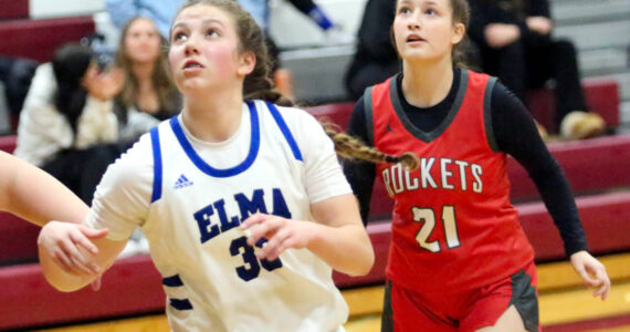 RYAN SPARKS | THE DAILY WORLD Elma sophomore Olivia Moore and Castle Rock’s Sophia Buchanan during the Eagles’ 42-34 win in a 1A District 4 Tournament elimination game on Thursday at Montesano High School.