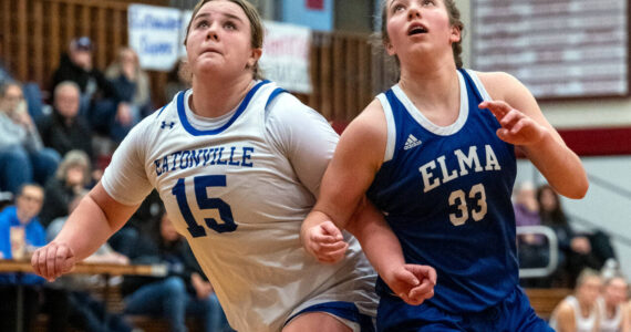 PHOTO BY FOREST WORGUM Elma’s Olivia Moore (33) and Eatonville’s Sara Smith compete for a rebound during the Eagles’ 50-44 loss in a 1A District 4 Tournament game on Saturday at Hoquiam High School.