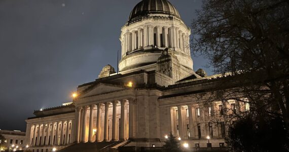 The Washington State Legislative Building in Olympia is illuminated the evening of Thursday, Feb. 15, the day the Senate released its proposed supplemental capital budget. (Clayton Franke / The Daily World)