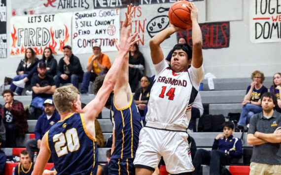 PHOTO BY LARRY BALE Raymond junior guard Chris Quintana (14), seen here in a file photo, was named to the 2B Pacific All-League Boys Basketball First Team after leading the Seagulls in scoring this season.