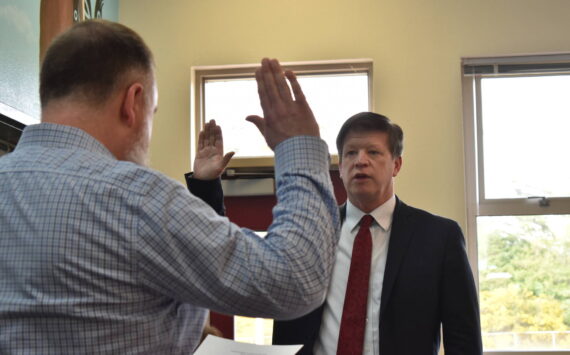Dr. Jim Shank takes the oath of North Beach superintendent's office June 20, 2023. Longview School District announced Feb. 17 that Shank is a finalist for its superintendent job. (The Daily World file photo)