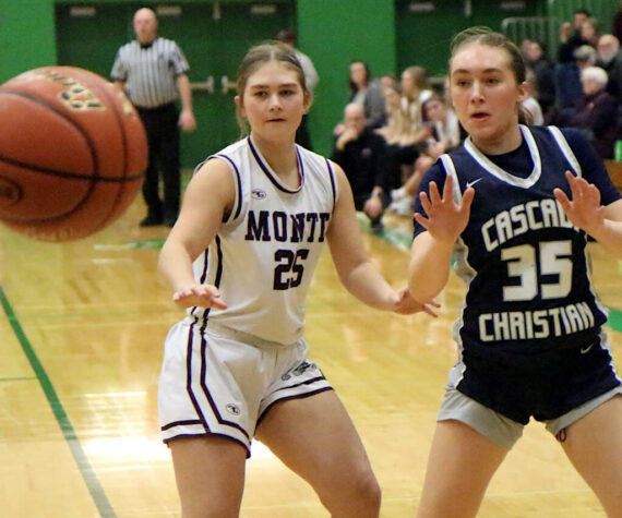 RYAN SPARKS | THE DAILY WORLD Montesano’s Regan Wintrip (25) defends Cascade Christian’s Brooklyn Whittington during the Bulldogs’ 41-25 win in a 1A State first-round game on Saturday at Tumwater High School.