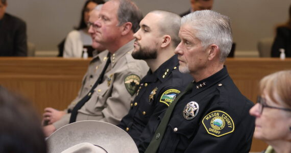 Michael S. Lockett / The Daily World
Sheriffs and police chiefs watch during a public hearing on a police pursuit initiative in Olympia on Wednesday.