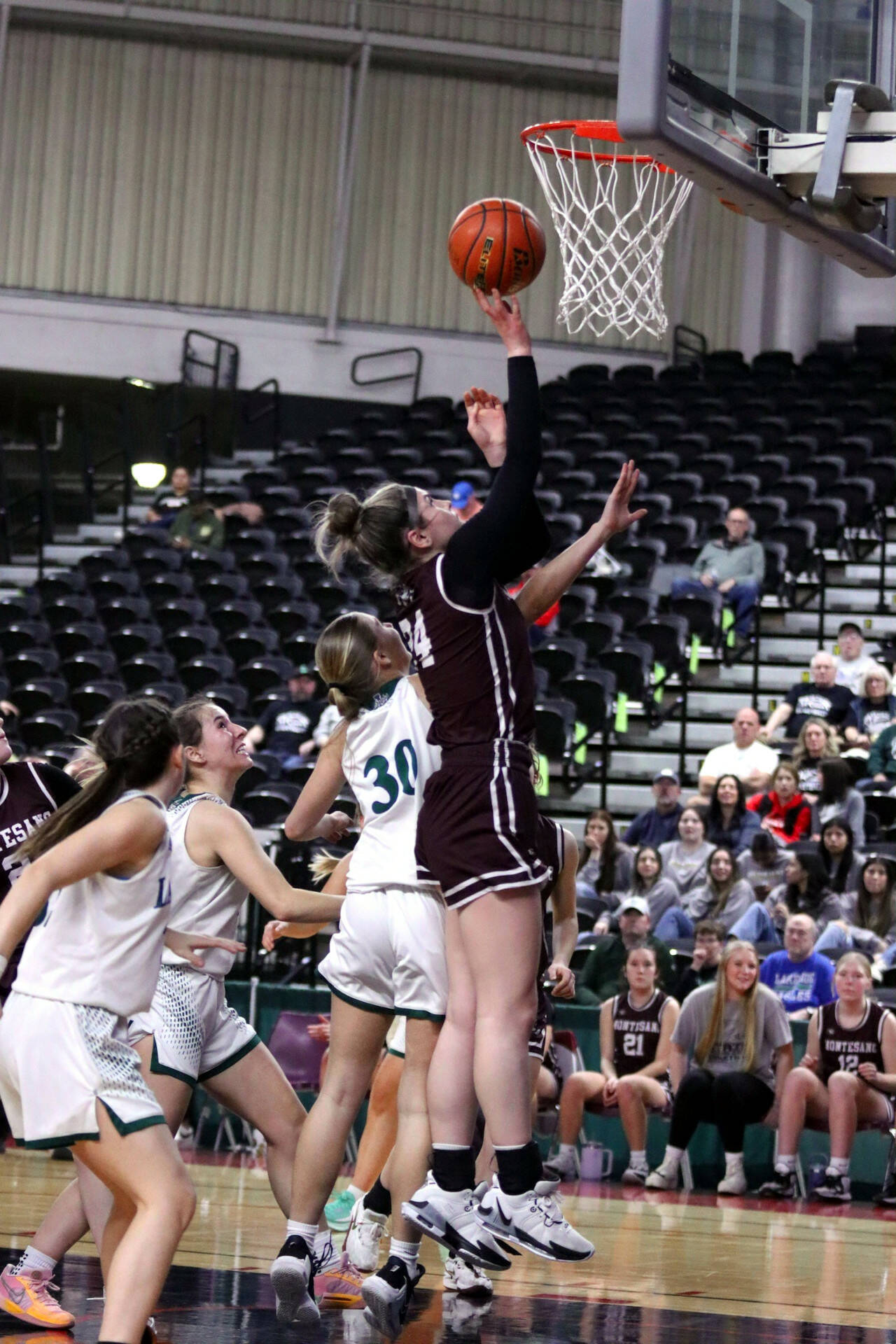 PHOTO BY HAILEY BLANCAS Montesano forward Jillie Dalan, right, scores two of her team-high 14 points during the Bulldogs’ 59-35 loss to Lakeside in a 1A State Tournament Round of 12 game on Wednesday in Yakima.