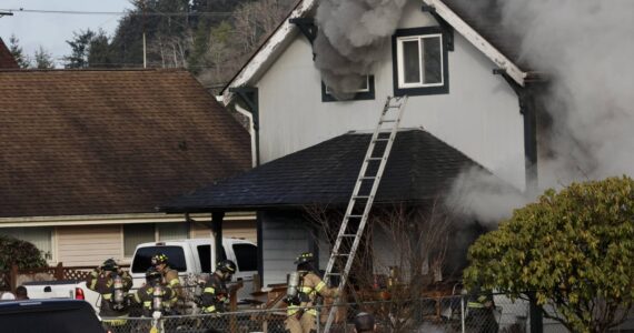Michael S. Lockett / Daily World File
Hoquiam firefighters respond to a fire in 2023.