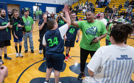 Mary White
Gerald Smiley, former Texas Rangers pitcher, high-fives Kyler Parmley at the 2023 Grays Harbor Hawks celebrity basketball game.