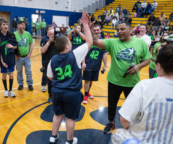 <p>Mary White</p>
                                <p>Gerald Smiley, former Texas Rangers pitcher, high-fives Kyler Parmley at the 2023 Grays Harbor Hawks celebrity basketball game.</p>